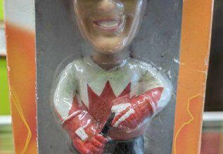 Hand painted bobble head doll.