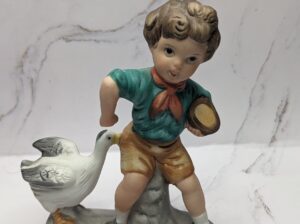 Boy with Duck Figure