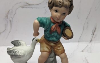 Boy with Duck Figure
