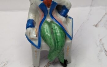 Porcelain Man In Chair