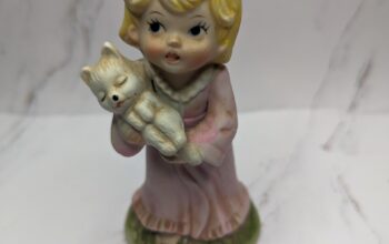 Girl Figure holding dog